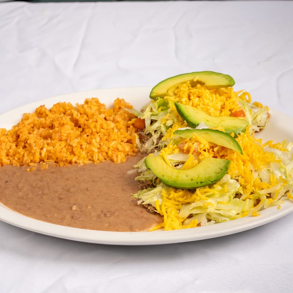 Chalupas served with rice and refried beans.